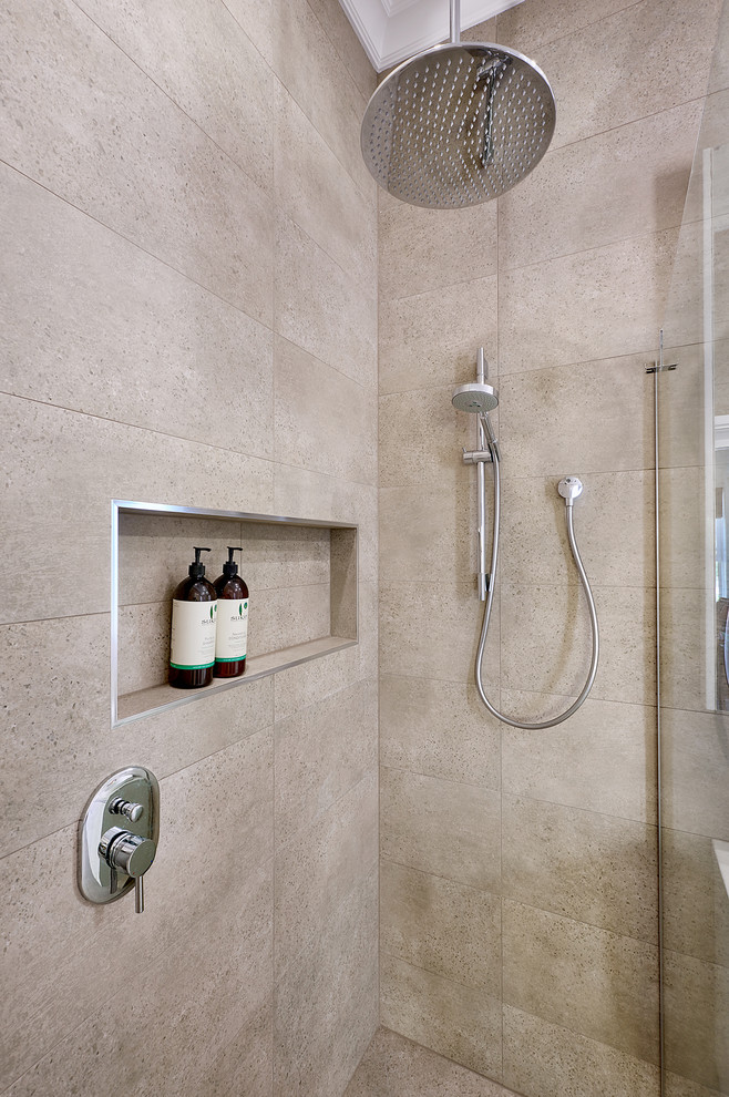This is an example of a mid-sized modern bathroom in Melbourne with beige walls and ceramic floors.