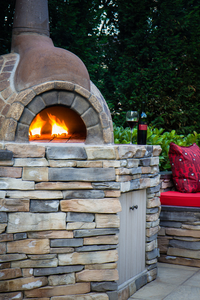 Design ideas for a rustic full sun backyard concrete paver landscaping.