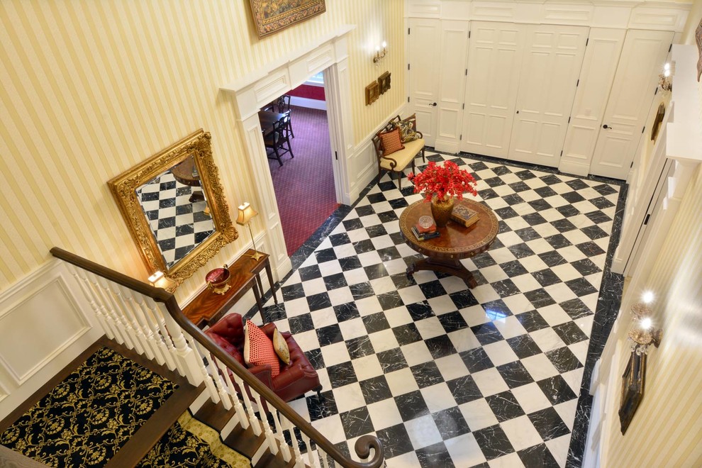 Mid-sized transitional marble floor entry hall photo in Seattle with yellow walls