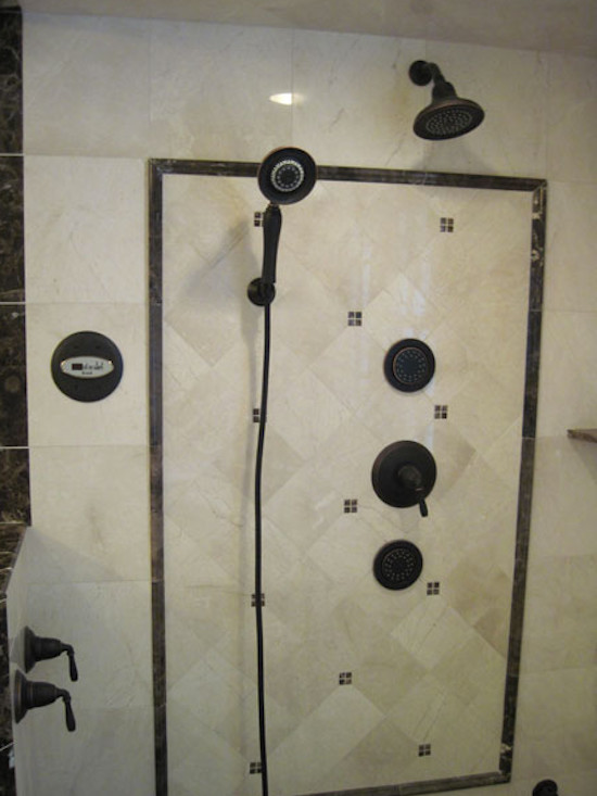Large beige tile corner shower photo in New York