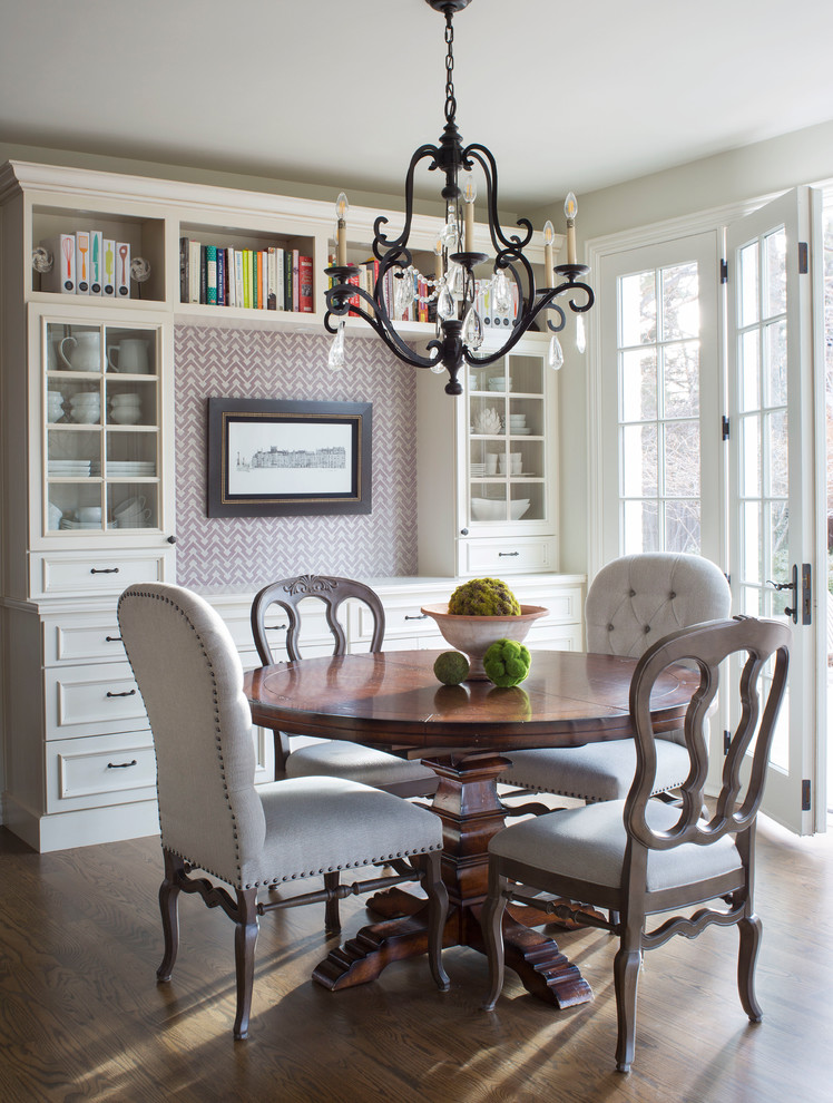 Example of a mid-sized transitional medium tone wood floor and brown floor kitchen/dining room combo design in Denver with white walls