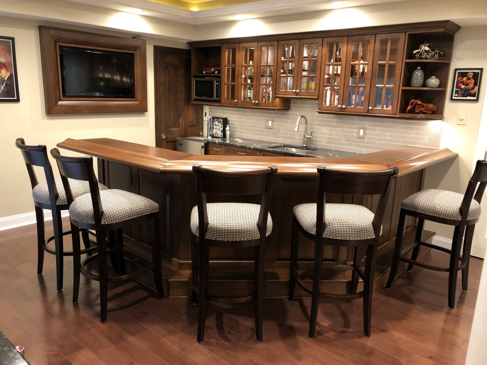 Example of an arts and crafts home bar design in Baltimore