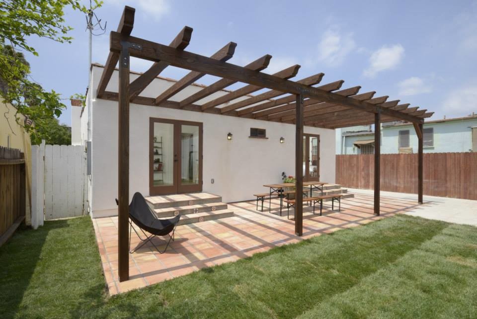 Mid-sized backyard patio in Los Angeles with a pergola.