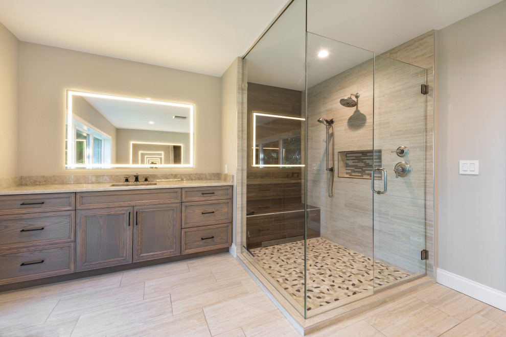 Photo of a large contemporary master bathroom in Tampa with beaded inset cabinets, medium wood cabinets, a japanese tub, a corner shower, a one-piece toilet, vinyl floors, an undermount sink, engineered quartz benchtops, brown floor, a hinged shower door, multi-coloured benchtops, a double vanity and a built-in vanity.