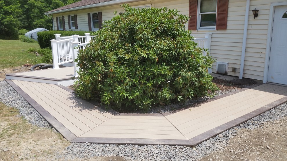 Example of a mid-sized side yard deck design with no cover