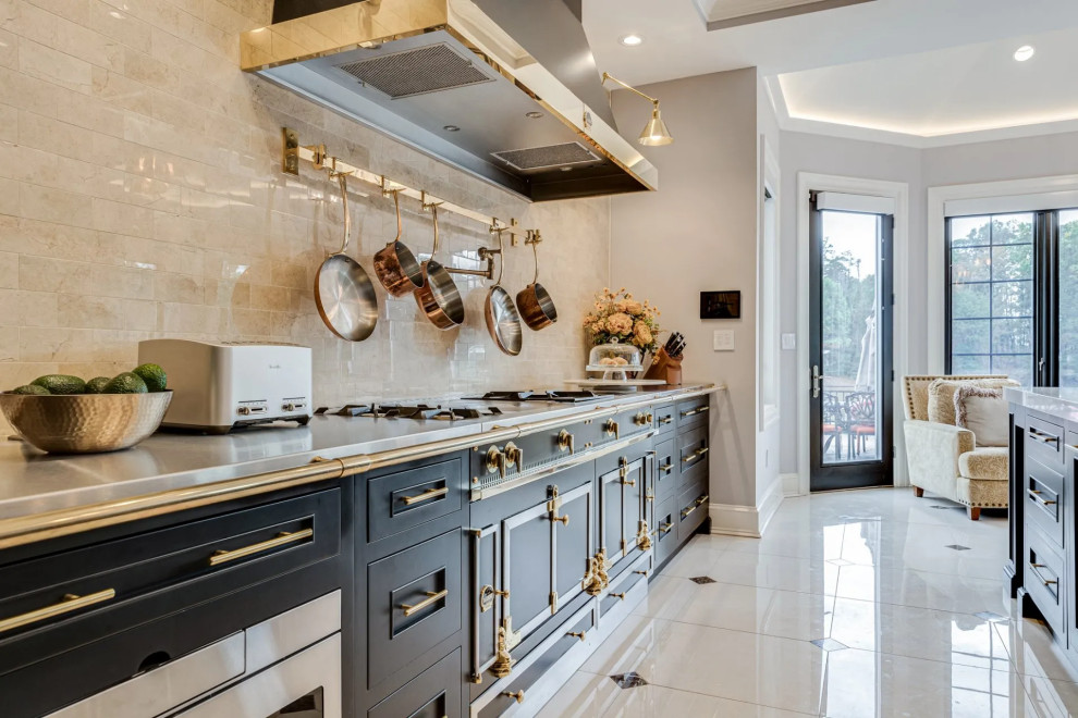 Example of a transitional beige floor kitchen design in Baltimore with black cabinets, beige backsplash, an island and beige countertops