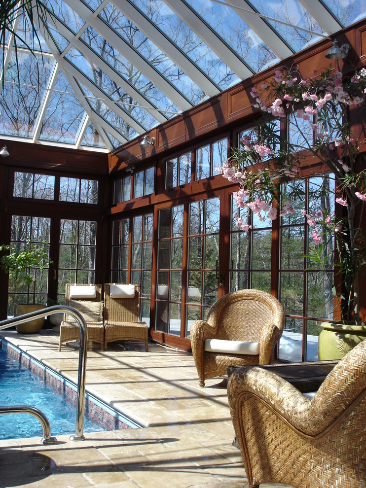 This is an example of a mid-sized traditional sunroom in Boston with marble floors, a glass ceiling and brown floor.