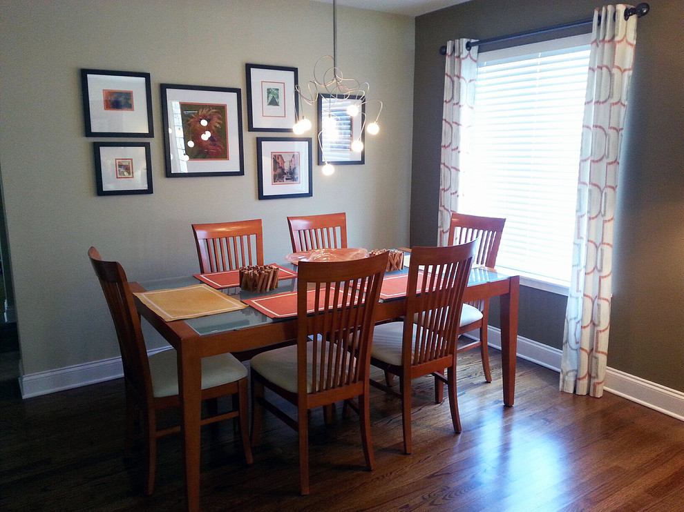 Design ideas for a small contemporary open plan dining in Orlando with brown walls and medium hardwood floors.