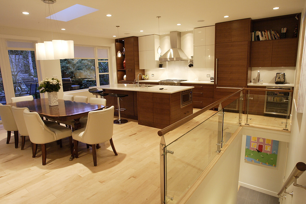 This is an example of a contemporary eat-in kitchen in Vancouver.