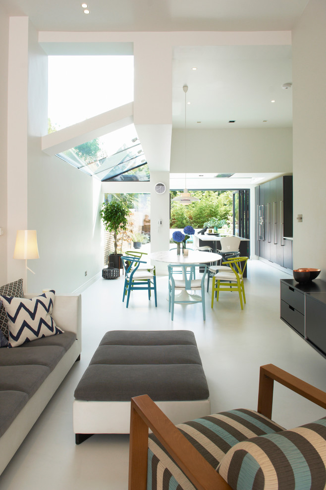 This is an example of a contemporary open concept living room in London.