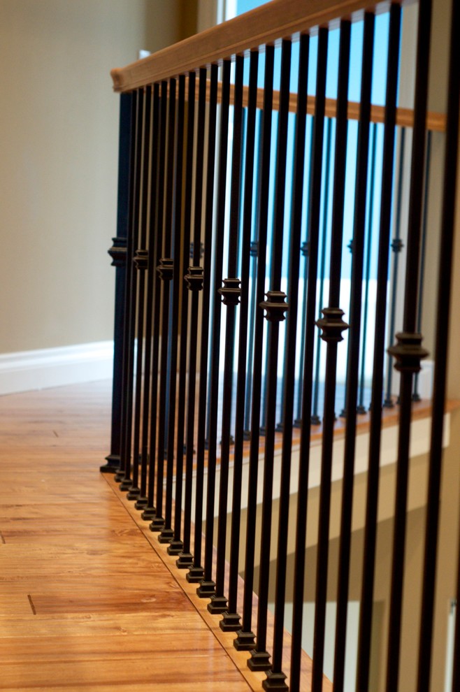 Contemporary wood staircase in Seattle with painted wood risers.