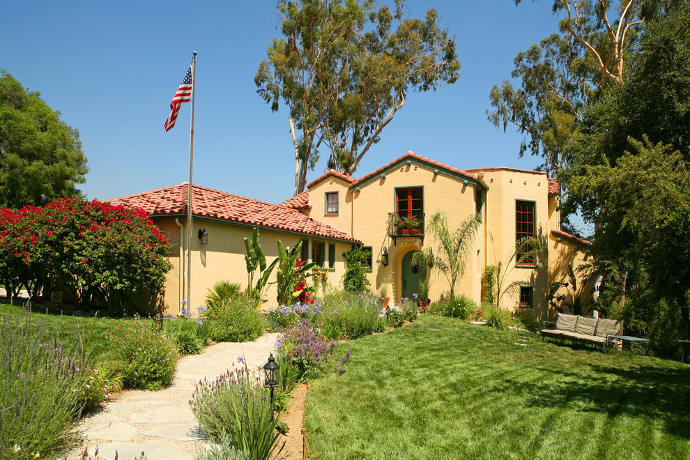 This is an example of a mediterranean two-storey stucco exterior in Los Angeles.