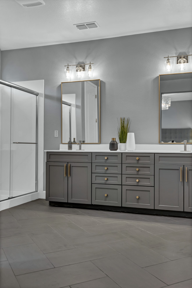 Mid-sized contemporary master bathroom in San Francisco with shaker cabinets, grey cabinets, a two-piece toilet, white tile, stone slab, grey walls, porcelain floors, an undermount sink, engineered quartz benchtops, grey floor, a sliding shower screen, white benchtops, a double vanity and a built-in vanity.