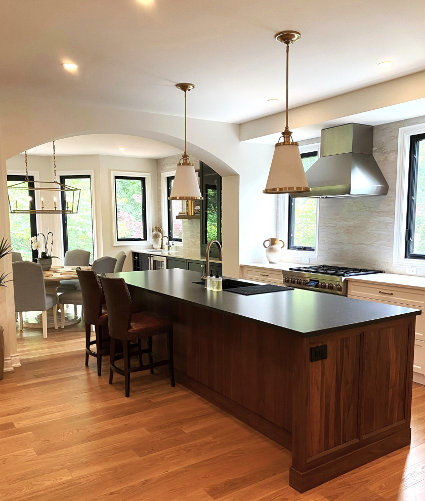 Open concept kitchen - large transitional l-shaped light wood floor open concept kitchen idea in Toronto with an undermount sink, recessed-panel cabinets, white cabinets, quartz countertops, paneled appliances and an island
