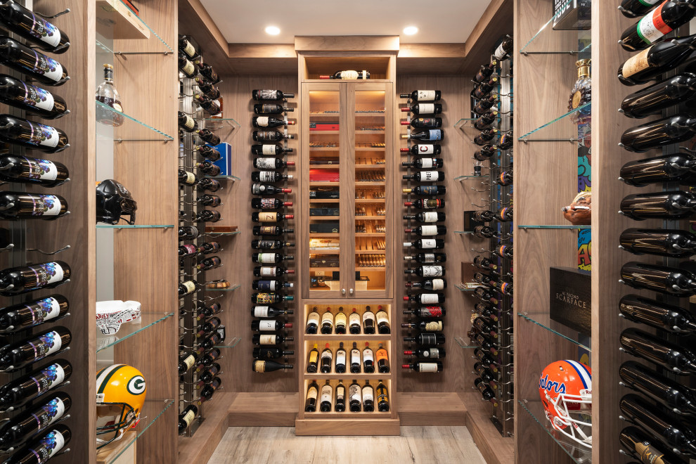 Design ideas for a mid-sized contemporary wine cellar in Toronto with light hardwood floors, brown floor and display racks.