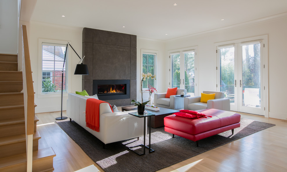 Photo of a large contemporary open concept living room in DC Metro with white walls, a ribbon fireplace and a metal fireplace surround.