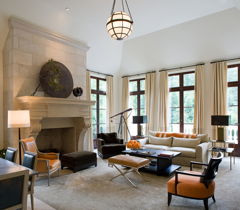 Design ideas for a large traditional formal enclosed living room in Atlanta with white walls, a standard fireplace, travertine floors, a stone fireplace surround and a wall-mounted tv.