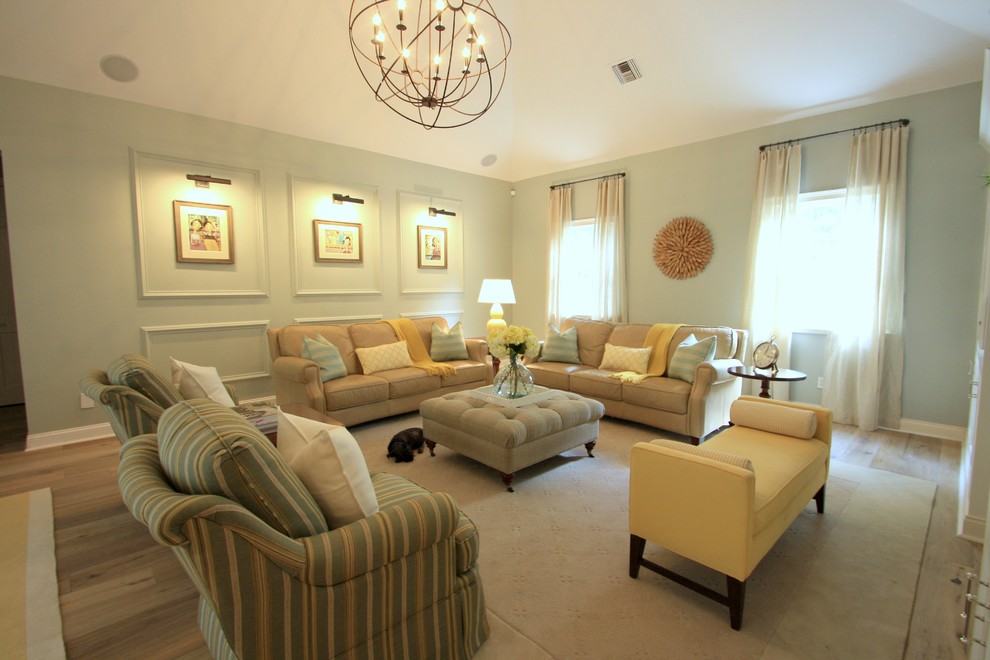 Transitional medium tone wood floor living room photo in Orlando with gray walls