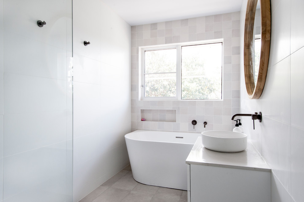 Design ideas for a small beach style master bathroom in Melbourne with white cabinets, a corner tub, a corner shower, white tile, ceramic tile, white walls, ceramic floors, a vessel sink, laminate benchtops, beige floor, a hinged shower door and white benchtops.