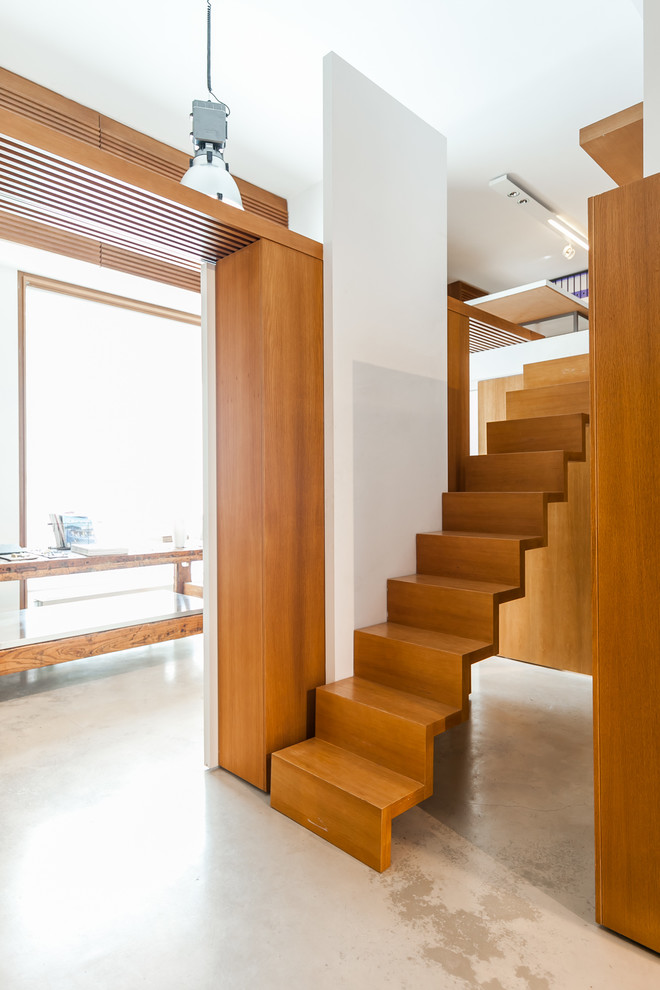 Design ideas for a small contemporary wood straight staircase in Rome with wood risers.