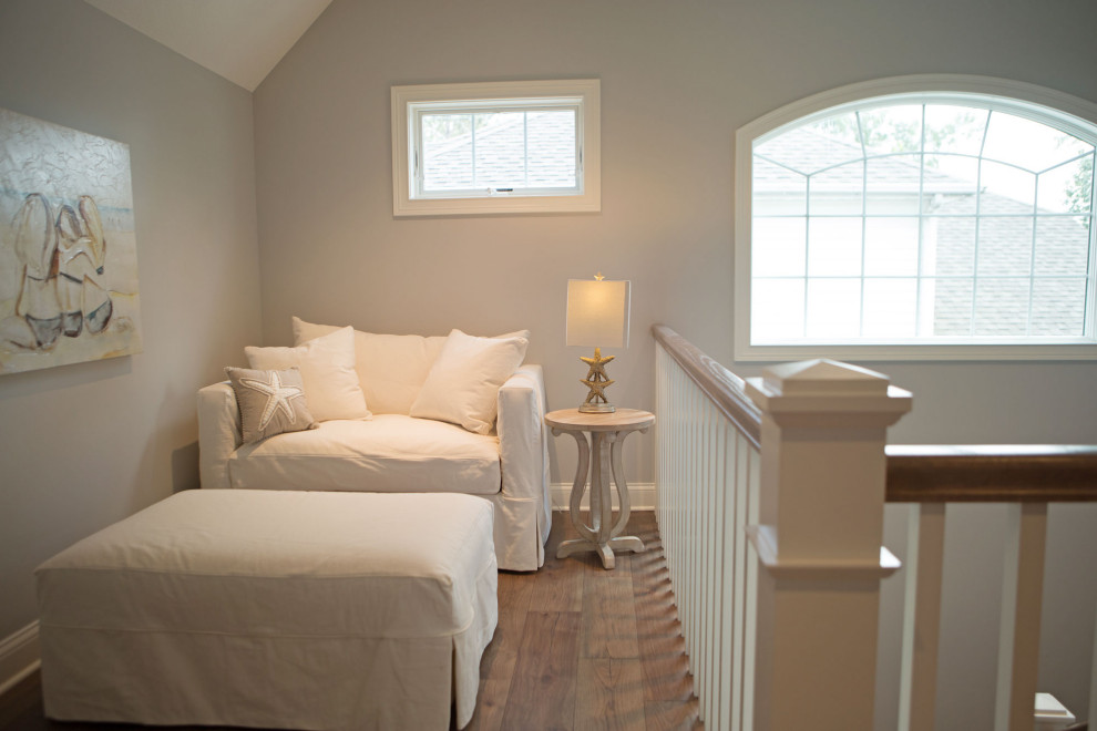 This is an example of a small arts and crafts hallway in Other with grey walls, dark hardwood floors and brown floor.