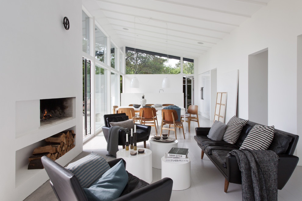 Large scandinavian formal open concept living room in Barcelona with white walls, painted wood floors, a ribbon fireplace, a plaster fireplace surround and no tv.