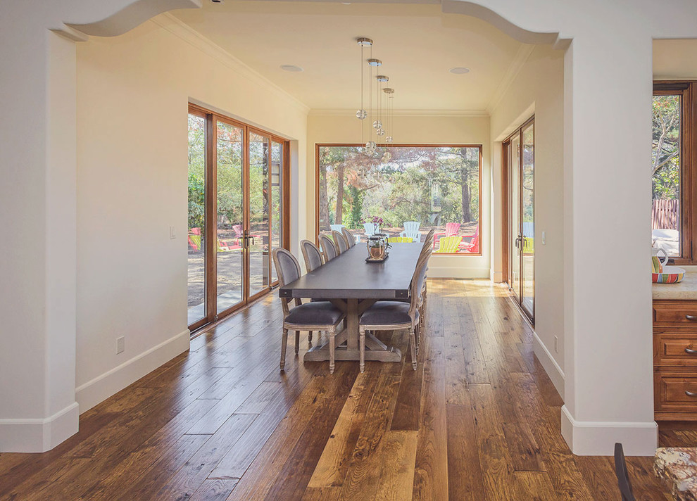 Inspiration for a traditional dining room in Atlanta with medium hardwood floors.