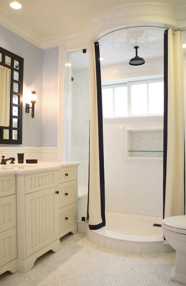 Photo of a traditional bathroom in Los Angeles with white cabinets, an alcove shower, white tile and subway tile.