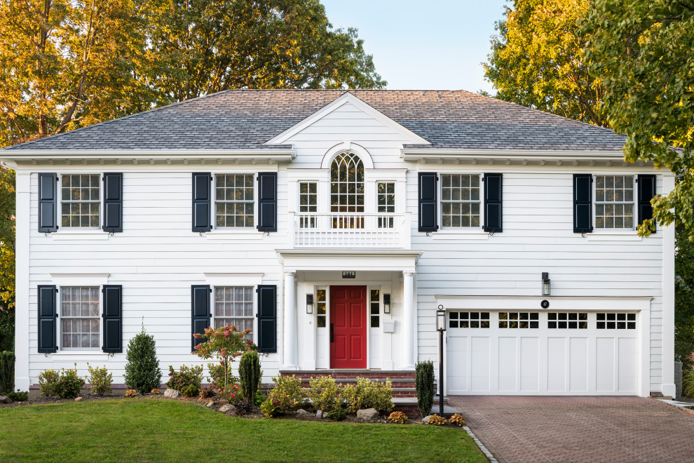 Large traditional two-storey white house exterior in New York with concrete fiberboard siding, a hip roof, a shingle roof, a grey roof and clapboard siding.