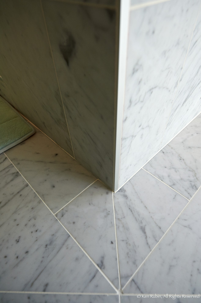 Example of a large transitional master gray tile, white tile and stone tile marble floor corner shower design in DC Metro with recessed-panel cabinets, white cabinets, a two-piece toilet, white walls, an undermount sink and granite countertops