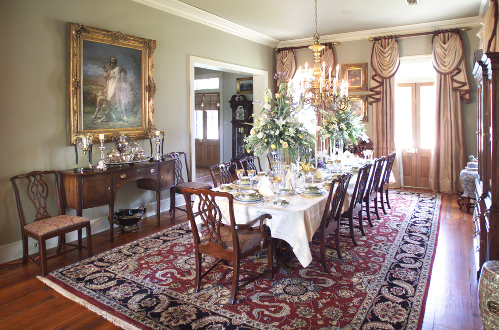 Inspiration for a mid-sized traditional separate dining room in New Orleans with beige walls, medium hardwood floors and no fireplace.