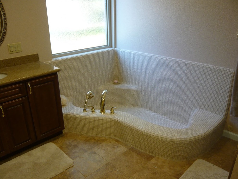 Inspiration for a large transitional master beige tile corner bathtub remodel with beige walls