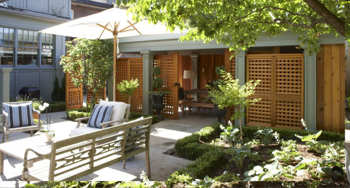 Inspiration for a large transitional backyard patio in Toronto with a vegetable garden and concrete pavers.