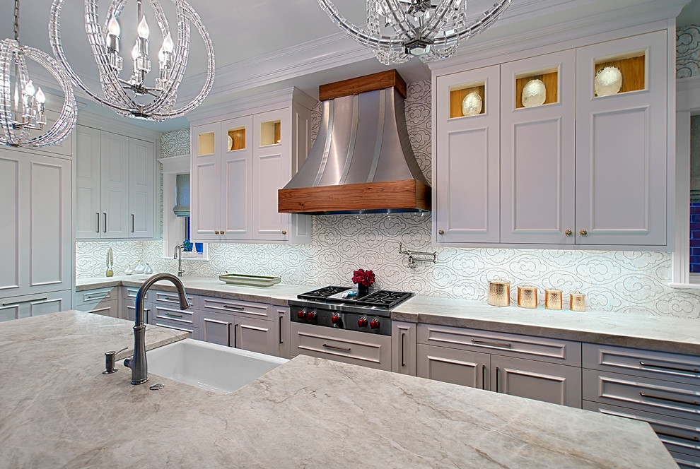 Photo of a transitional kitchen in Chicago with white cabinets, quartzite benchtops, mosaic tile splashback, dark hardwood floors, with island, recessed-panel cabinets, white splashback, stainless steel appliances and beige benchtop.