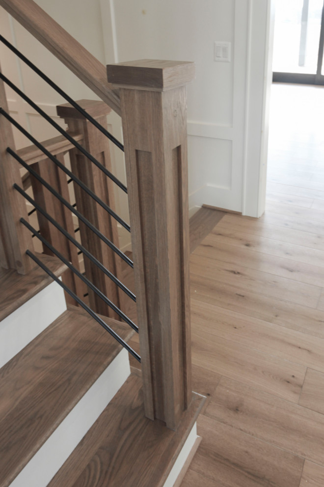 Large retro wood floating mixed railing staircase in DC Metro with wood risers.