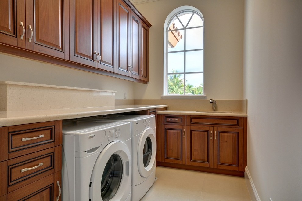 This is an example of a mediterranean laundry room in Miami.