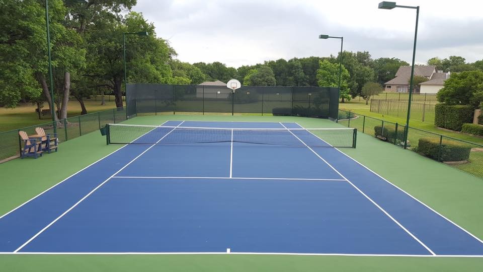 Mid-sized traditional backyard partial sun outdoor sport court in Austin with with outdoor playset and concrete pavers for summer.