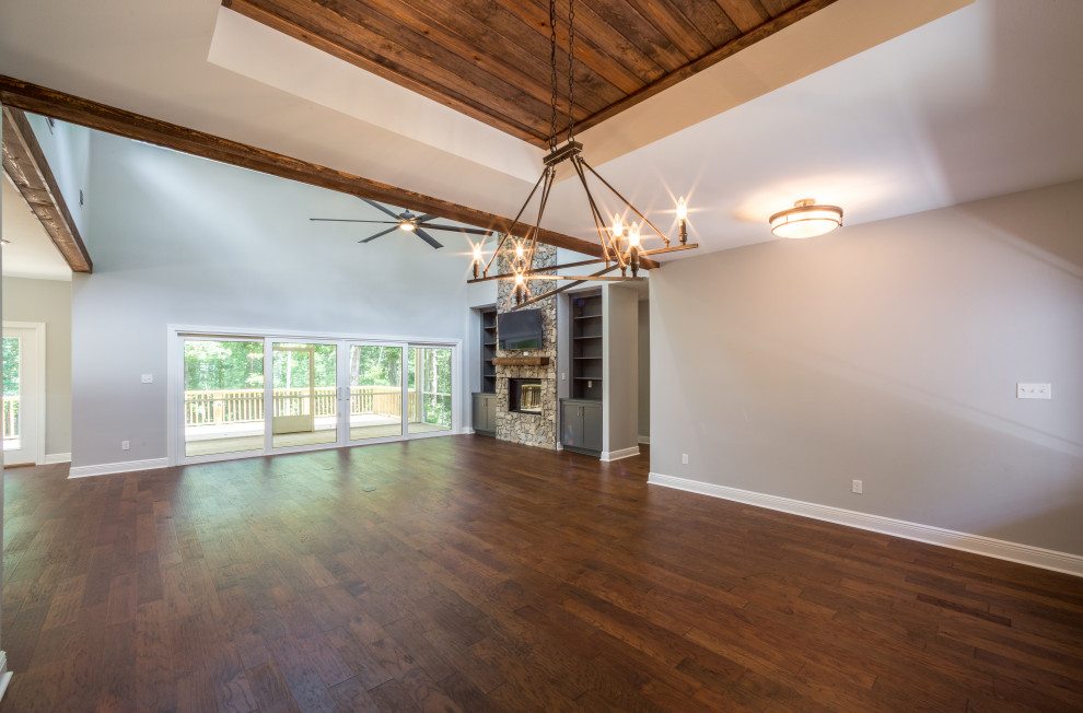Foyer - mid-sized traditional medium tone wood floor and brown floor foyer idea with beige walls and a glass front door