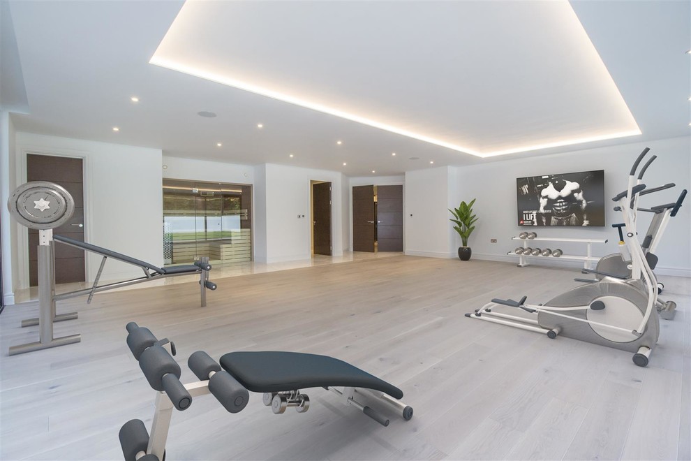 This is an example of a contemporary home gym in Devon.