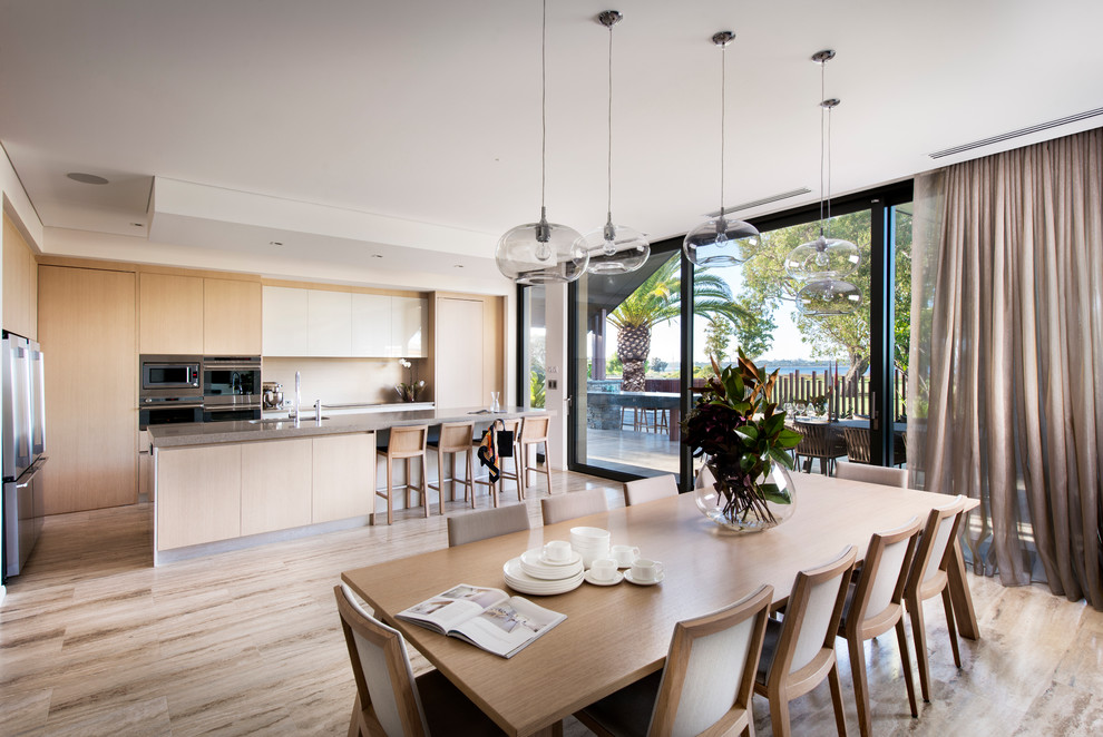 Design ideas for a contemporary kitchen/dining combo in Perth with light hardwood floors.