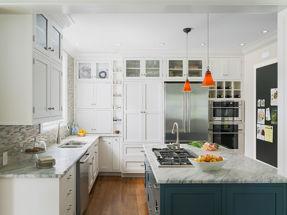 Inspiration for a transitional l-shaped kitchen in Philadelphia with a double-bowl sink, shaker cabinets, white cabinets, multi-coloured splashback, mosaic tile splashback, stainless steel appliances, medium hardwood floors and with island.