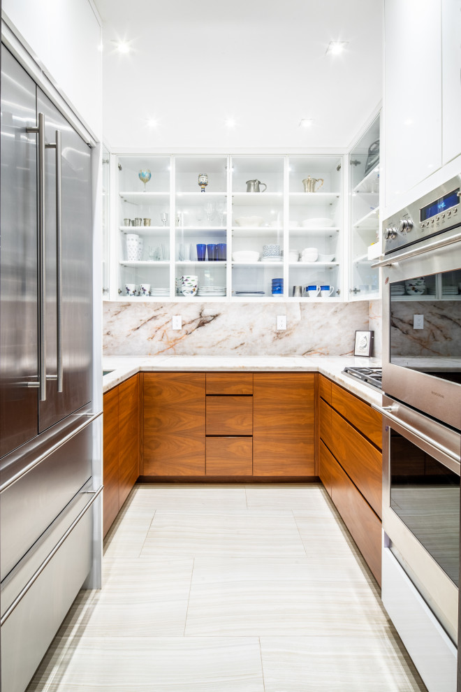 Photo of a small modern u-shaped separate kitchen in Miami with an undermount sink, flat-panel cabinets, medium wood cabinets, onyx benchtops, white splashback, stone slab splashback, panelled appliances, porcelain floors, white floor and white benchtop.