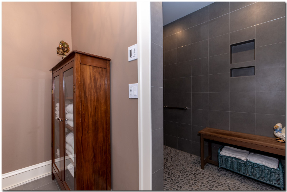 Design ideas for a large traditional 3/4 bathroom in Cleveland with open cabinets, a curbless shower, a two-piece toilet, green tile, porcelain tile, beige walls, porcelain floors, an integrated sink, recycled glass benchtops, beige floor, an open shower and blue benchtops.