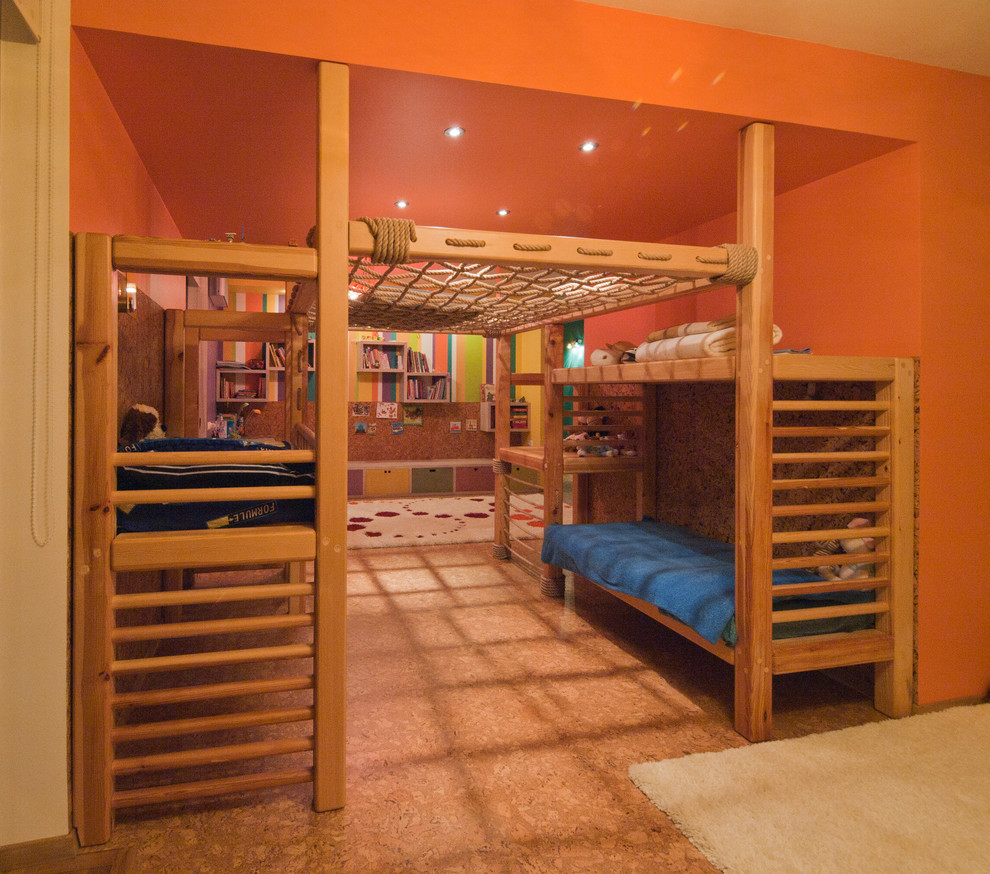 Contemporary kids' room in Other with cork floors and orange walls.