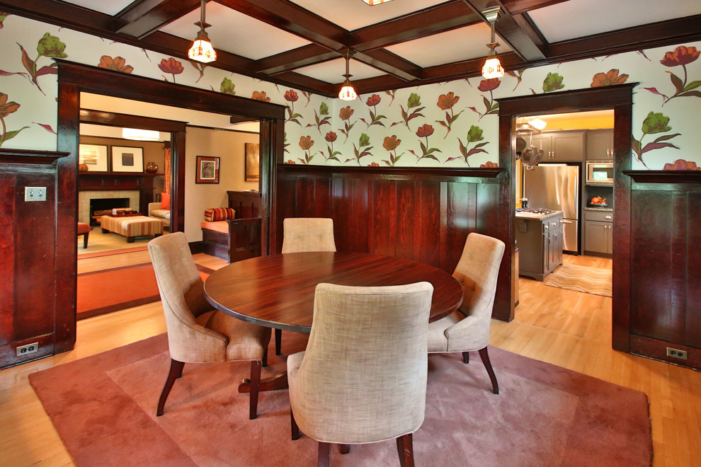 Design ideas for an arts and crafts dining room in Portland with multi-coloured walls and medium hardwood floors.