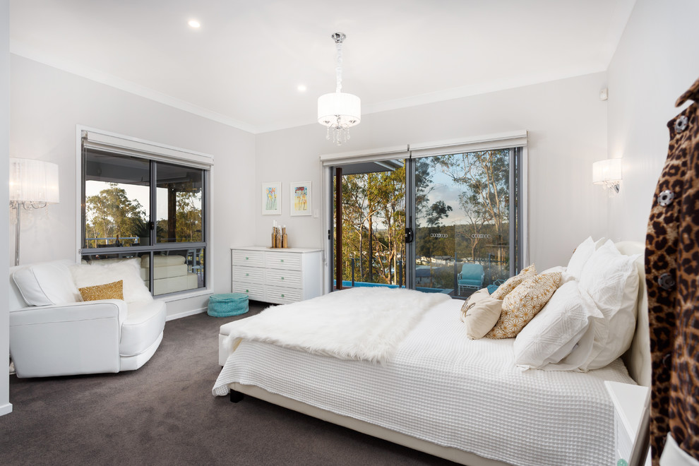 Photo of a transitional bedroom in Brisbane with grey walls, carpet and black floor.