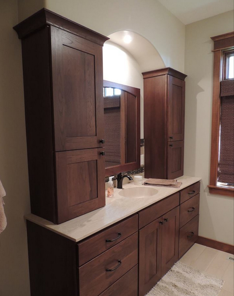 Drop-in bathtub - mid-sized transitional master beige tile and stone tile travertine floor and beige floor drop-in bathtub idea with shaker cabinets, brown cabinets, white walls and quartz countertops
