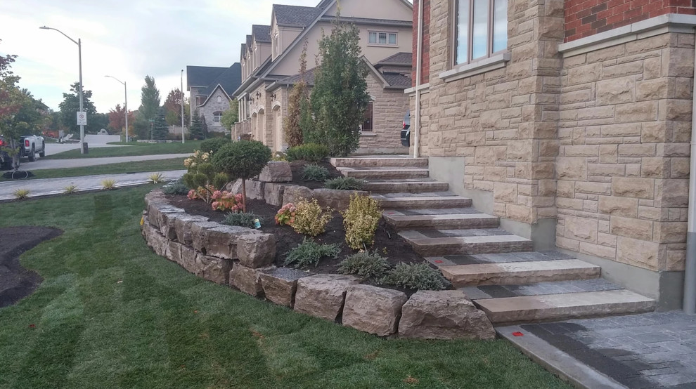 Photo of a mid-sized rustic full sun side yard stone landscaping in Phoenix.