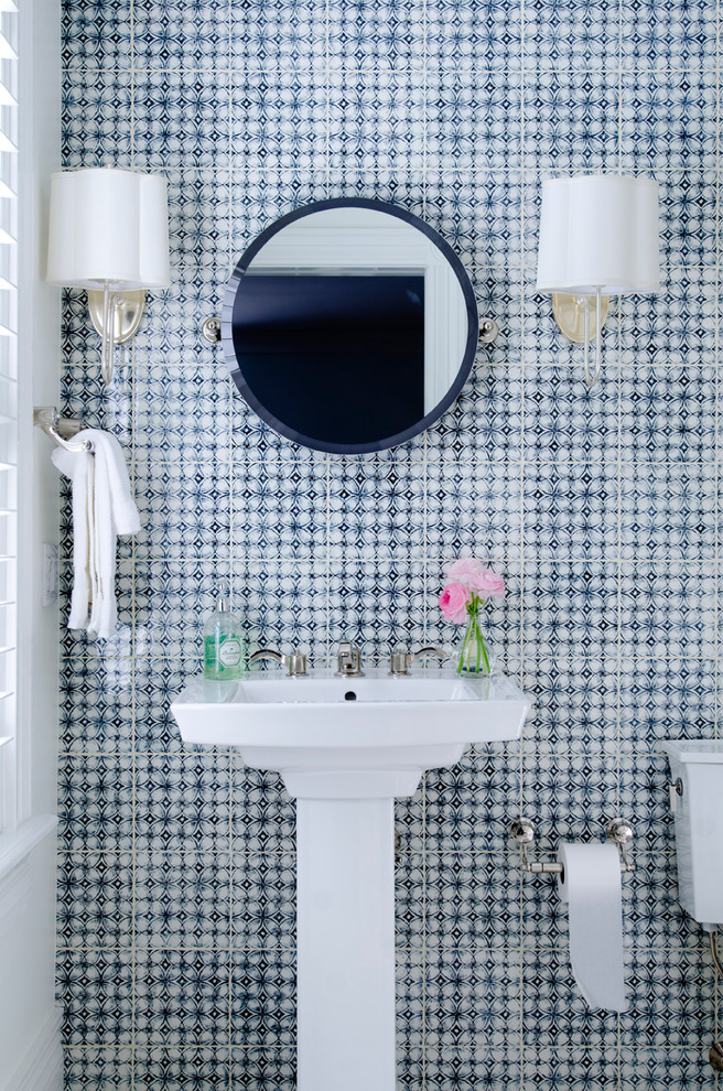 Beach style powder room in New York with a pedestal sink and blue tile.