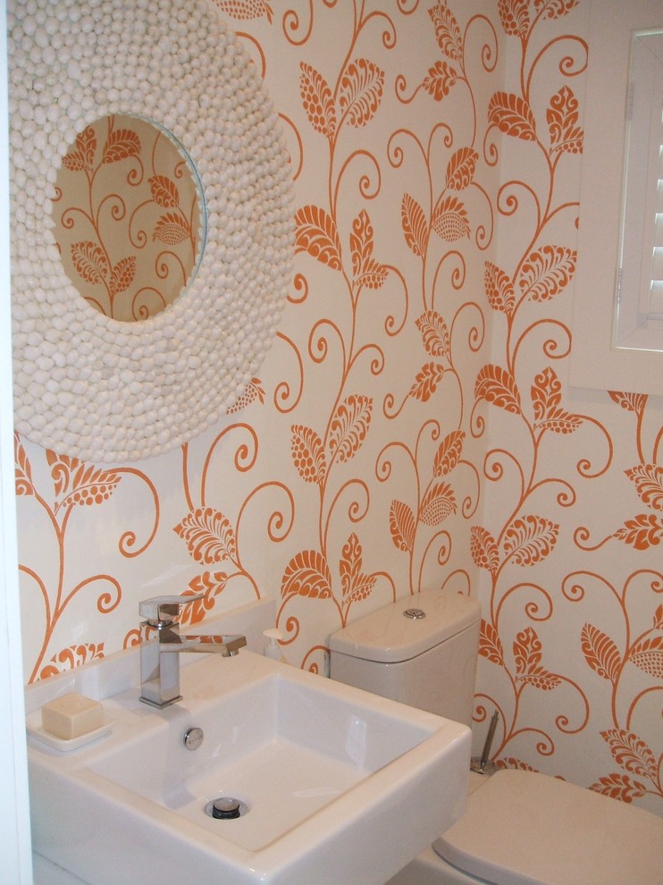 Small contemporary powder room in Sydney with open cabinets.